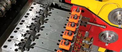 Differenza tra le macchine formatrici di bulloni e quelle formatrici di pezzi